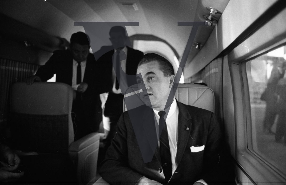Governor George Wallace, on board plane, portrait.