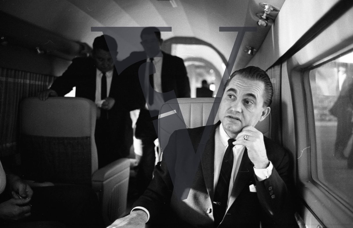 Governor George Wallace, on board plane, portrait.