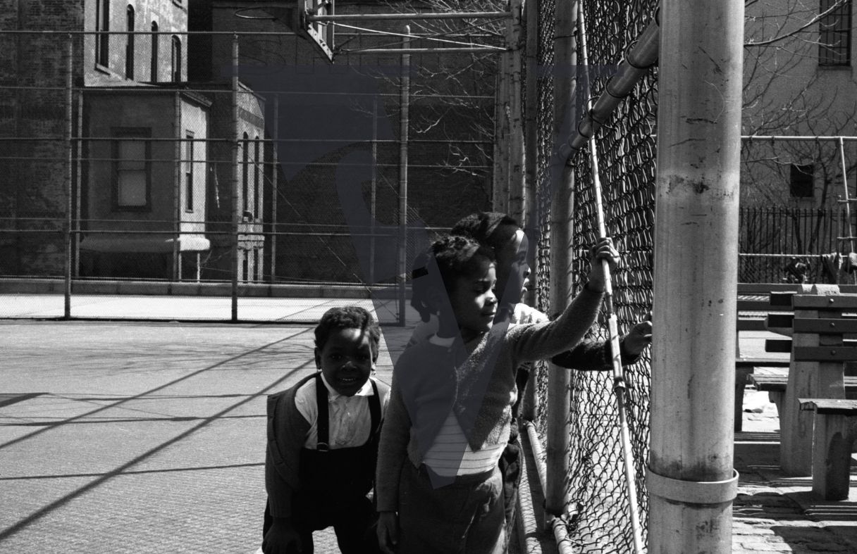 Harlem, New York City, playground, portrait, three children looking away.