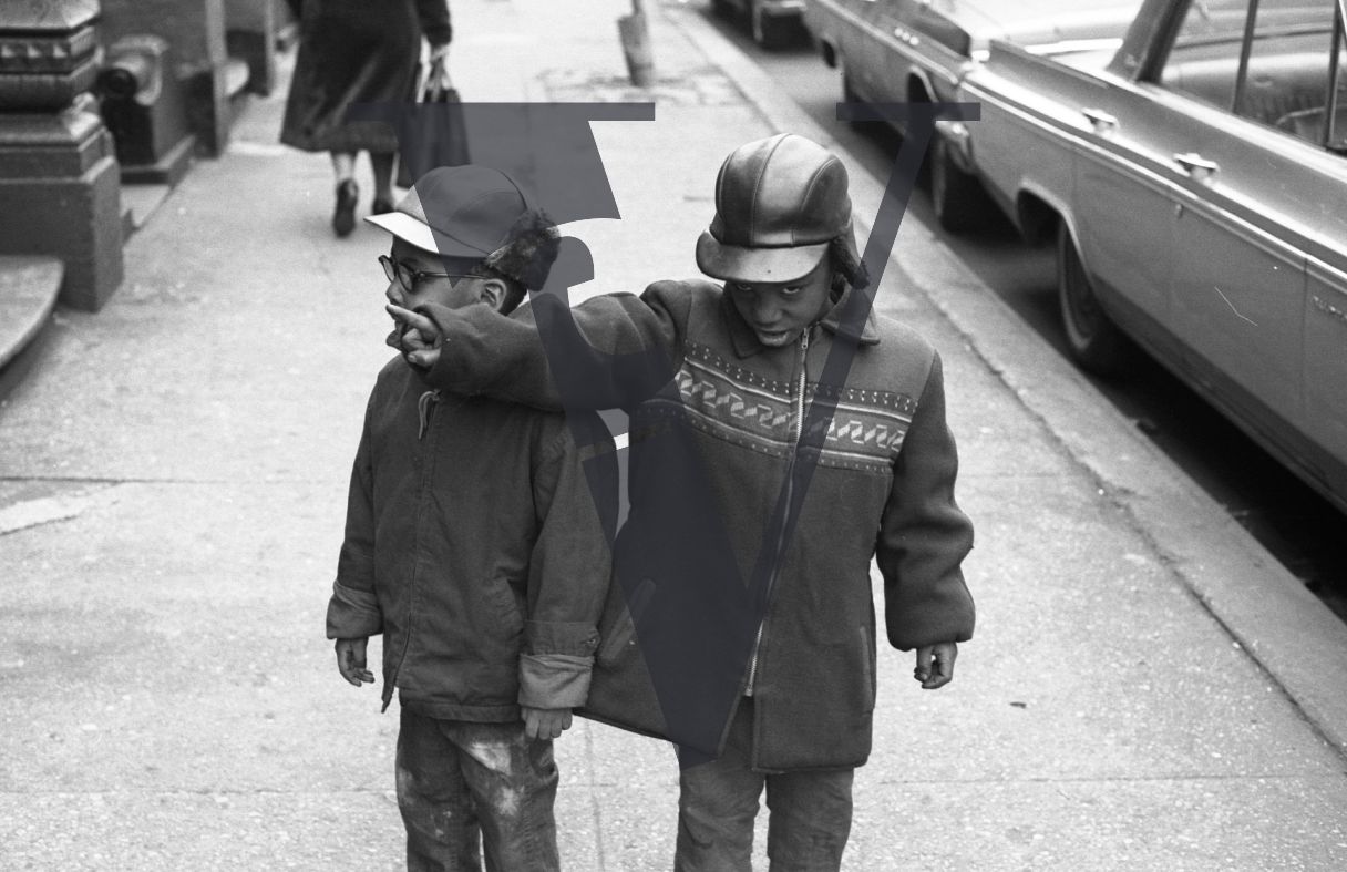 Harlem, New York City, two boys, portrait, pointing finger.