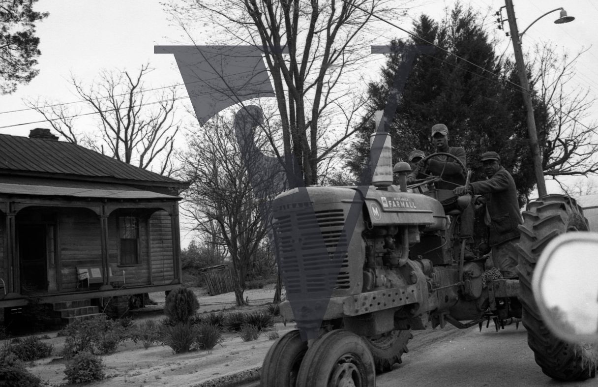 Mayesville, Sumter County, South Carolina, street scene, Farmall tractor and farmers.