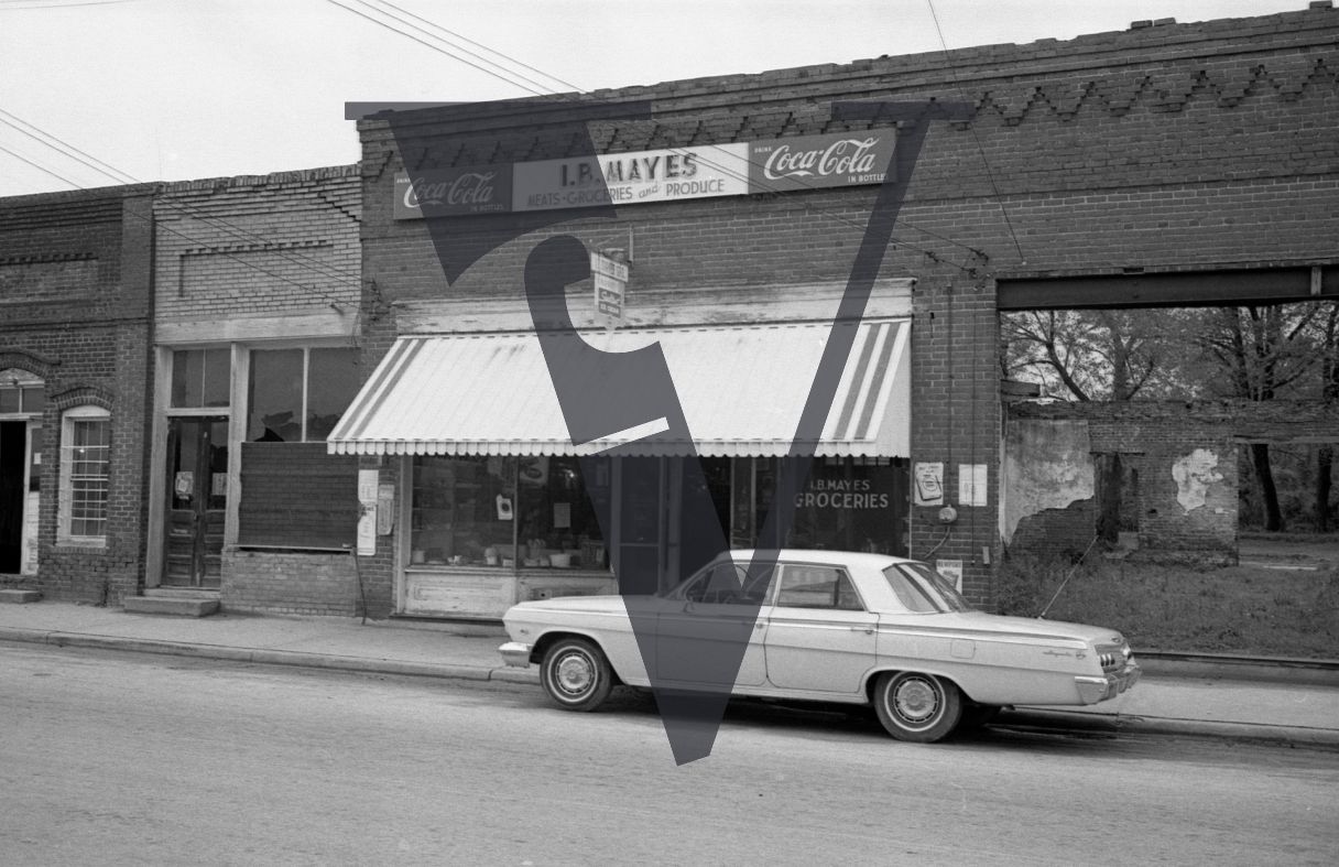 Mayesville, Sumter County, South Carolina, street scene, I.B. Mayes Groceries, white car.