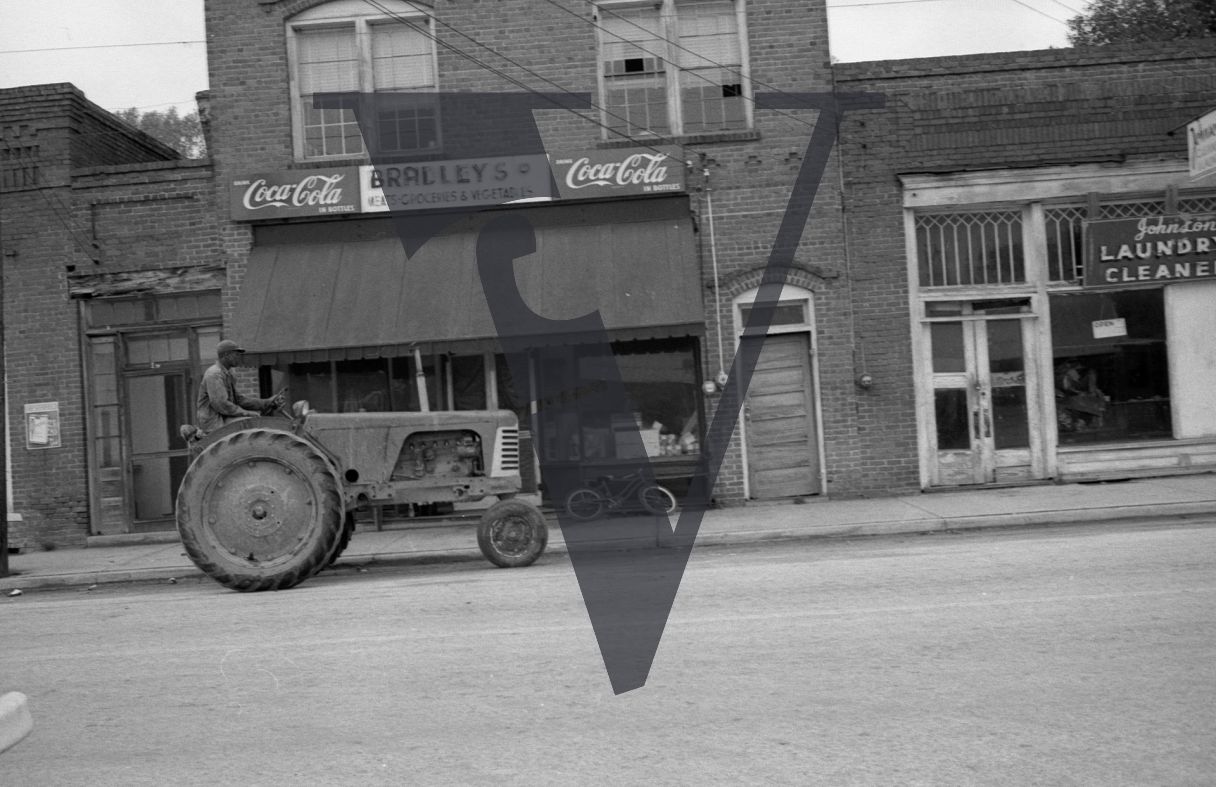 Mayesville, Sumter County, South Carolina, street scene, Bradley's store, man on tractor.