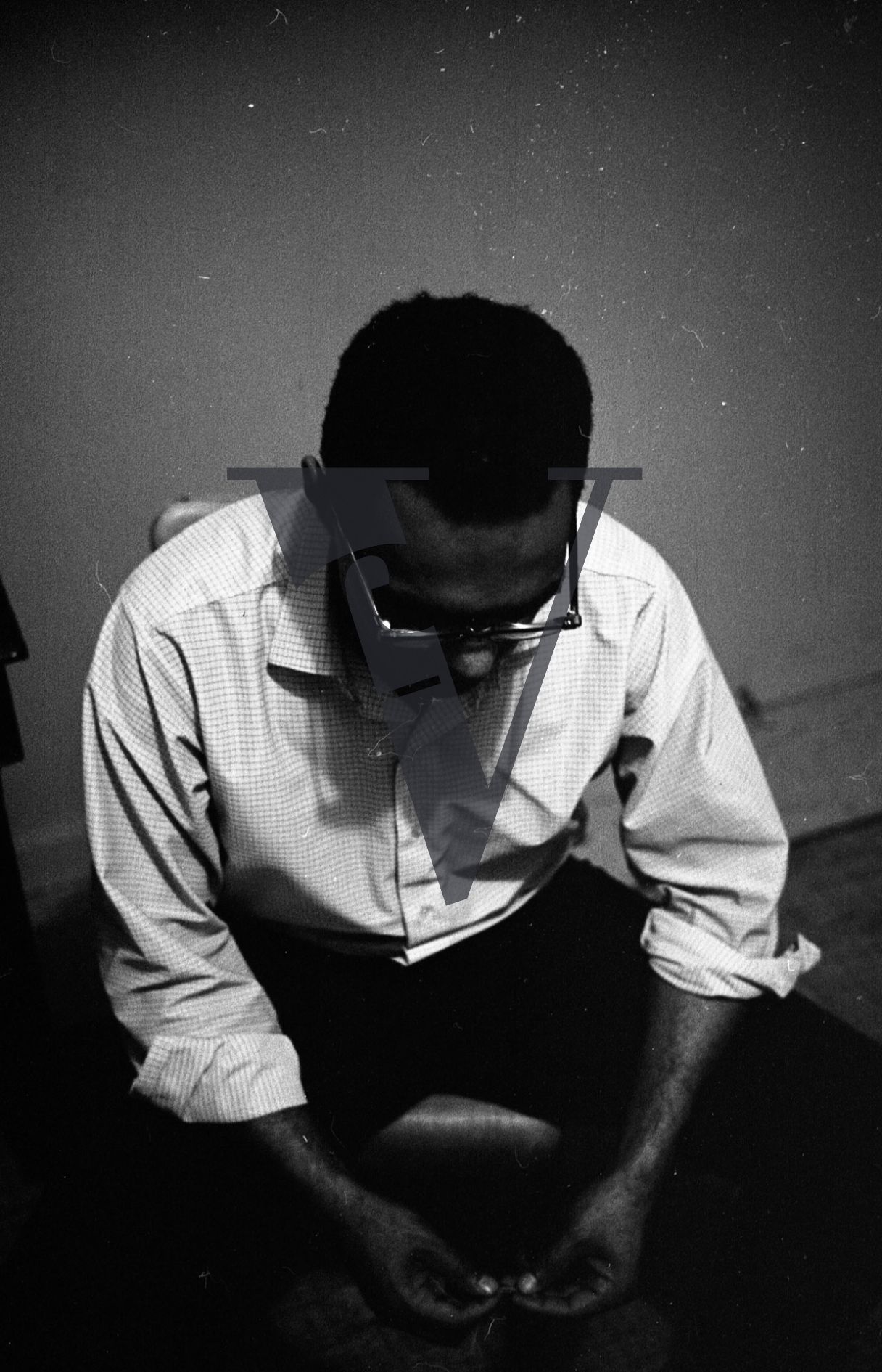 Robert Moses, portrait, Student Nonviolent Coordinating Committee, SNCC, head bowed, hands clasped.