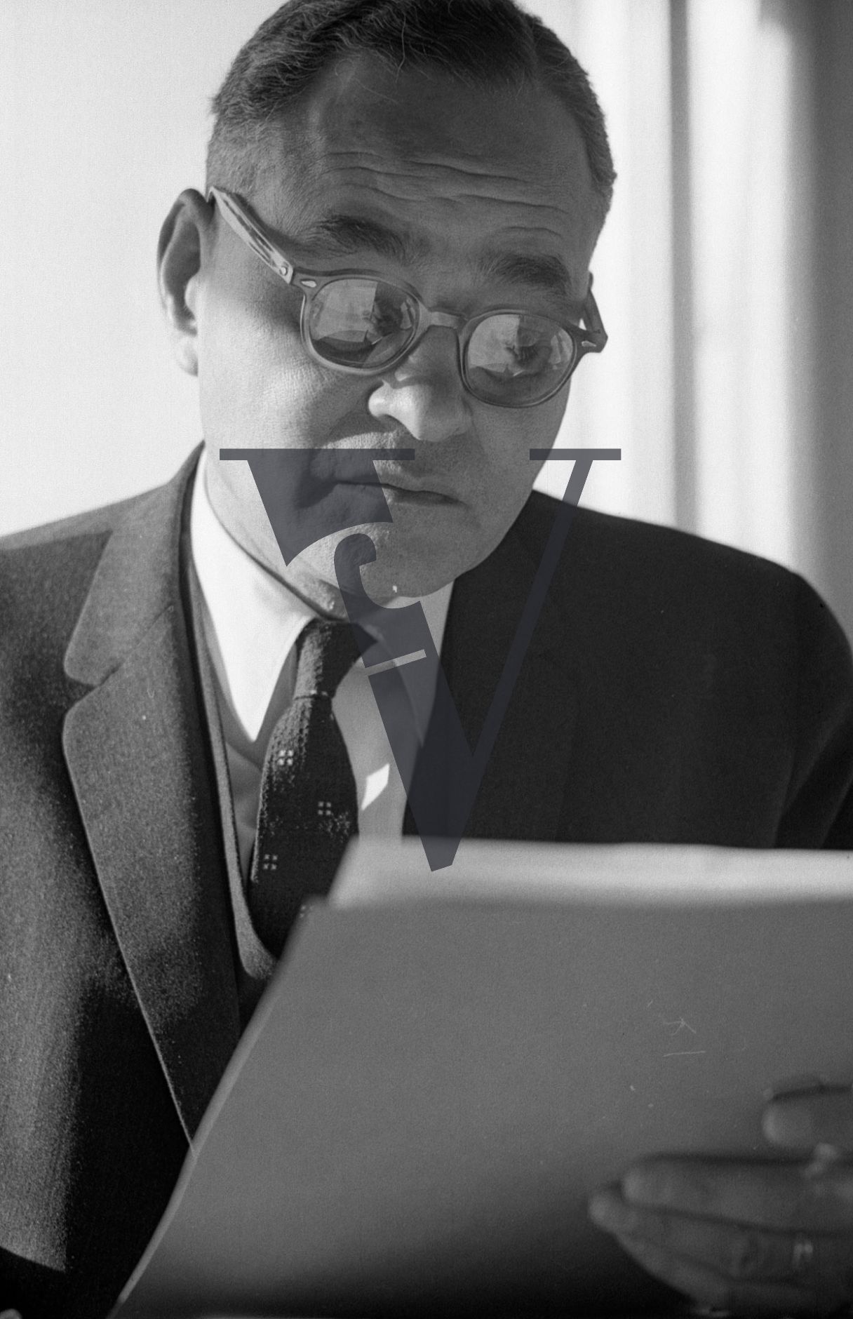 Ralph Bunche, portrait, writing, political scientist, diplomat, close-up, with document.